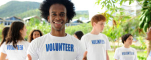 man in white volunteer shirt